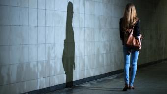 woman walking alone at night