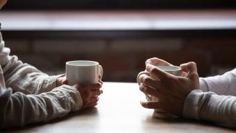 Stock Couple Talking Over Coffee