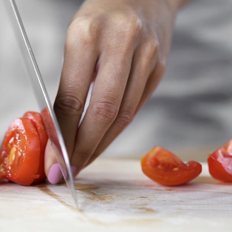 chopping tomatoes