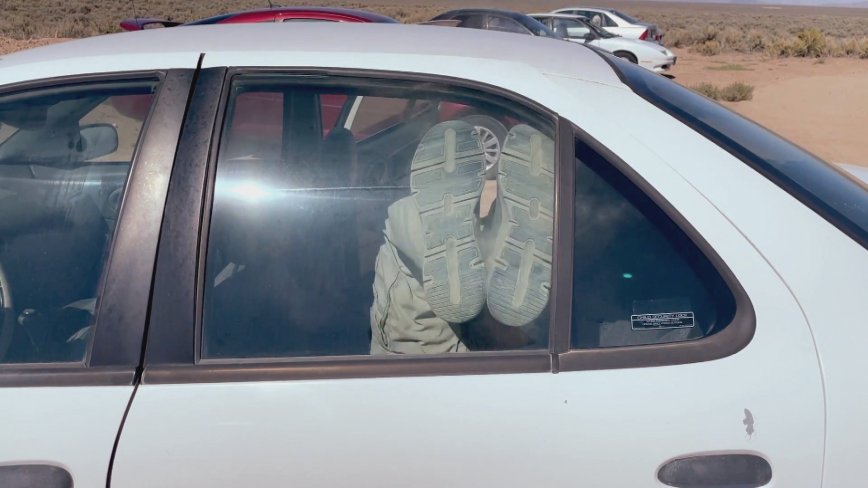 Jason Hanson demonstrating how to kick a car window