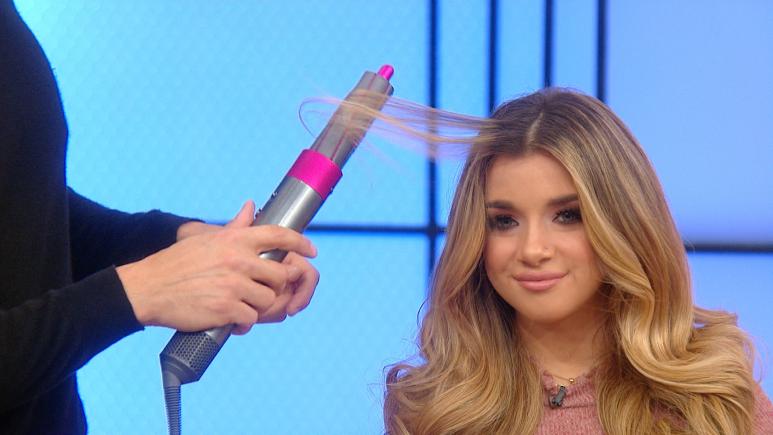 Chris Appleton using the Dyson AirWrap to curl a viewer's hair